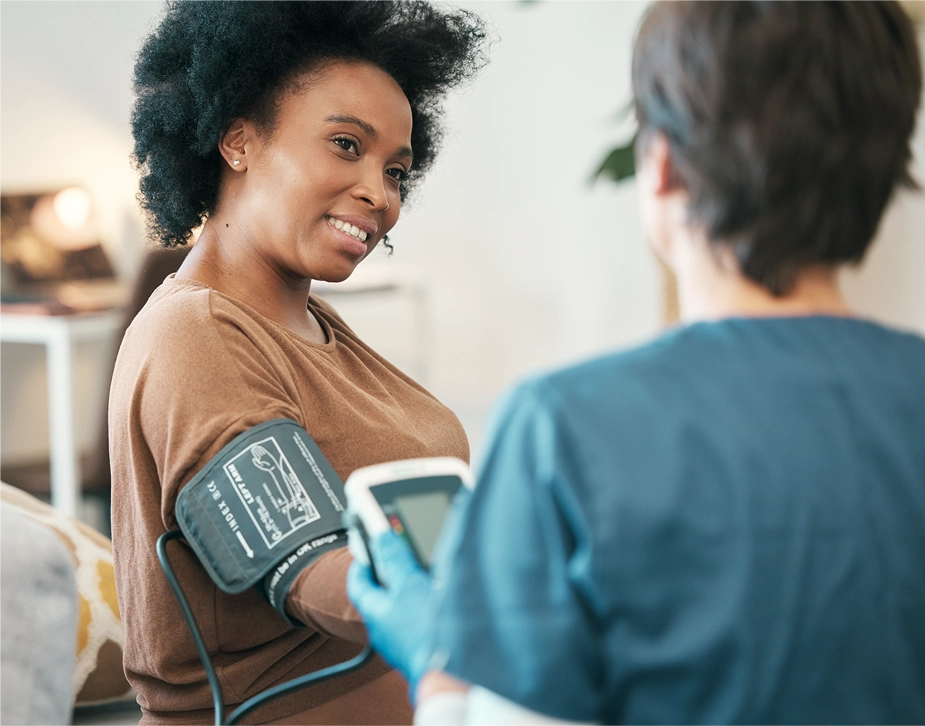 Woman receiving HIV primary care from a physician