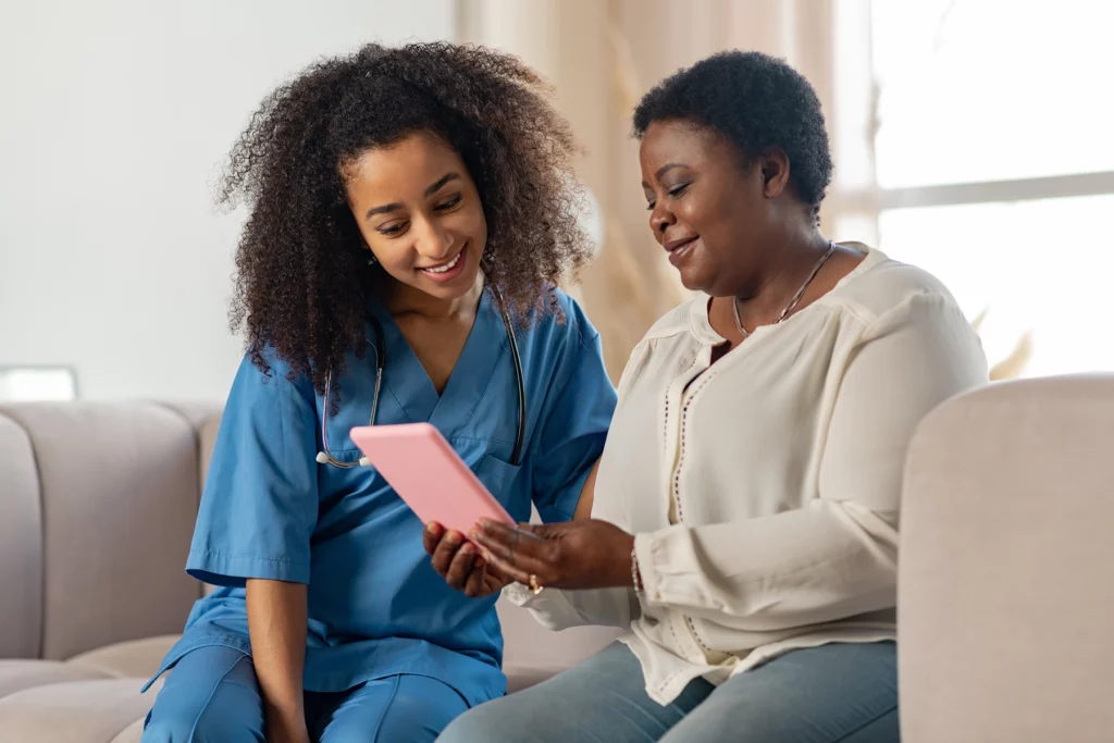 Nurse at HIV Clinic speaking with patient