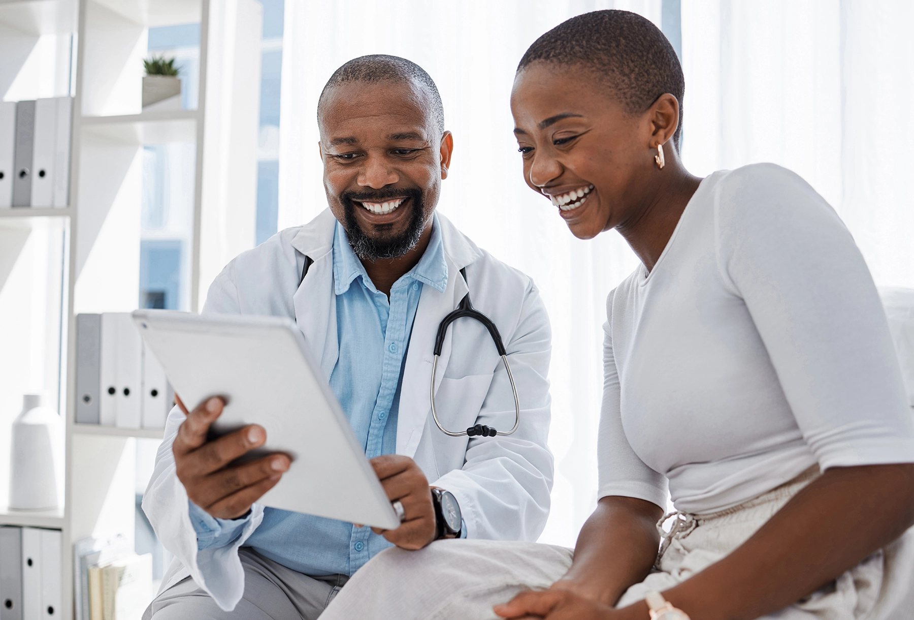 Healthcare team providing HIV care near me; checking chart with patient