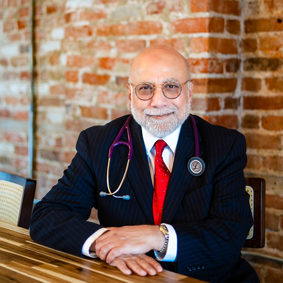 Doctor Hafeez smiling at an HIV clinic near me